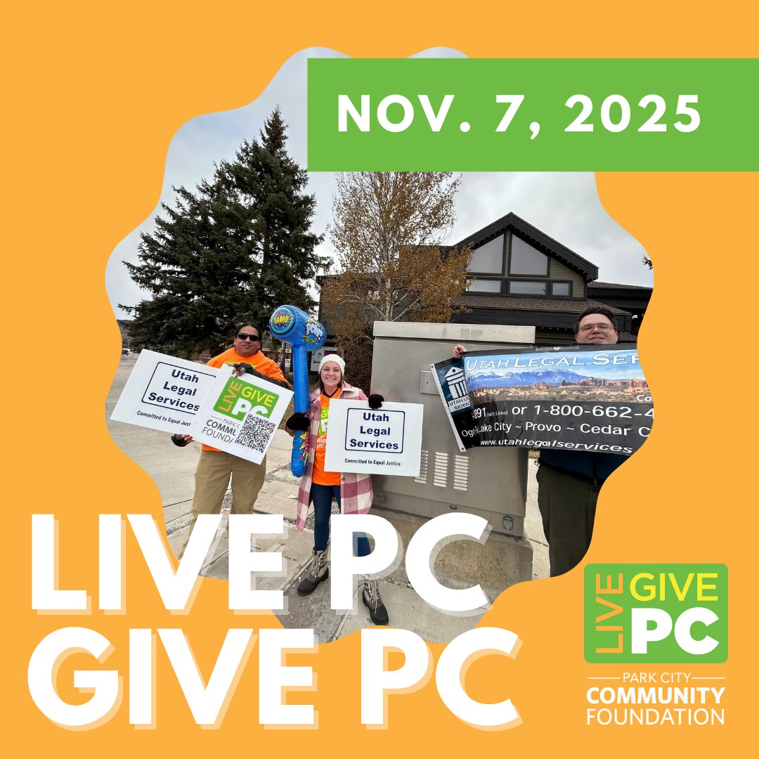 ULS staff holding Utah Legal Services signs at the Live PC Give PC event